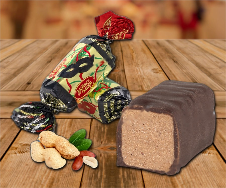 Confectionery with roasted and grated in a cocoa-based fat glaze